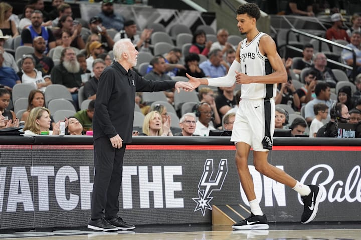 San Antonio Spurs head coach Gregg Popovich greets center Victor Wembanyama in the first half against the Orlando Magic.