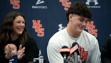 Nashville Christian's five-star quarterback Jared Curtis announces his decision to sign with Georgia with his family at his side at Nashville Christian School in Nashville, Tenn., Monday, May 5, 2025. Sister Kaitlyn Allsbrooks, left, and nephew Hudson, 2, were there to support him,.