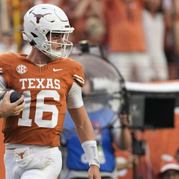 Sep 14, 2024; Austin, Texas, USA; Texas Longhorns quarterback Arch Manning (16) runs for a 67 yard touchdown during the first half against the Texas-San Antonio Roadrunners at Texas at Darrell K Royal-Texas Memorial Stadium. Mandatory Credit: Scott Wachter-Imagn Images