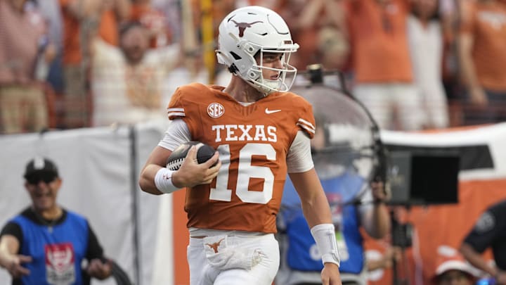 Sep 14, 2024; Austin, Texas, USA; Texas Longhorns quarterback Arch Manning (16) runs for a 67 yard touchdown during the first half against the Texas-San Antonio Roadrunners at Texas at Darrell K Royal-Texas Memorial Stadium. Mandatory Credit: Scott Wachter-Imagn Images