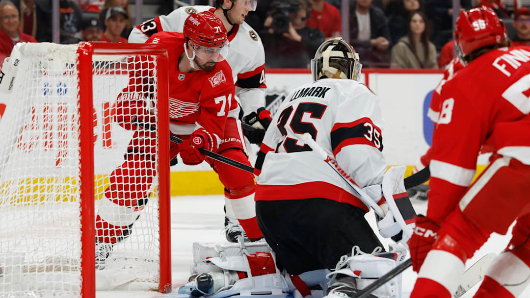 Mar 24, 2026; Detroit, Michigan, USA;  Detroit Red Wings center Dylan Larkin (71) tries to score on Ottawa Senators goaltender Linus Ullmark (35) in the second period at Little Caesars Arena. Mandatory Credit: Rick Osentoski-Imagn Images