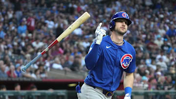 Mar 29, 2025; Phoenix, Arizona, USA; Chicago Cubs outfielder Kyle Tucker (30) hits a two-run home run against the Arizona Diamondbacks in the fifth inning at Chase Field. Mandatory Credit: Rick Scuteri-Imagn Images
