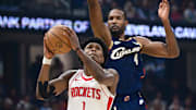 Nov 19, 2025; Cleveland, Ohio, USA; Houston Rockets guard Amen Thompson (1) goes to the basket against Cleveland Cavaliers center Evan Mobley (4) during the first half at Rocket Arena. Mandatory Credit: David Dermer-Imagn Images