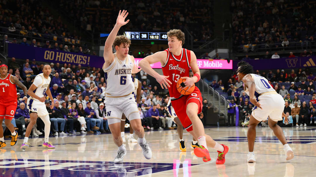 Jan 11, 2026; Seattle, Washington, USA; Ohio State Buckeyes center Christoph Tilly (13) dribbles towards the basket while guarded by Washington Huskies forward Hannes Steinbach (6) during the second half at Alaska Airlines Arena at Hec Edmundson Pavilion. Mandatory Credit: Steven Bisig-Imagn Images