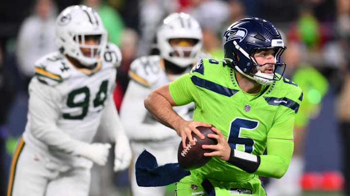 Dec 15, 2024; Seattle, Washington, USA; Seattle Seahawks quarterback Sam Howell (6) carries the ball against the Green Bay Packers during the second half at Lumen Field.