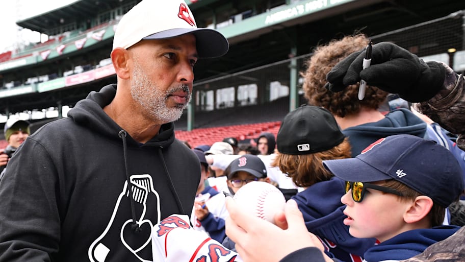 Red Sox manager Alex Cora signs autographs for fans