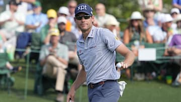 Adam Schenk reacts on the 18th green 