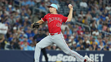 Jul 4, 2025; Toronto, Ontario, CAN; Los Angeles Angels relief pitcher Brock Burke (46) throws a pitch against the Toronto Blue Jays during the seventh inning at Rogers Centre. Mandatory Credit: Nick Turchiaro-Imagn Images
