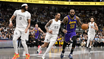 Dallas Mavericks forward Anthony Davis and Los Angeles Lakers forward LeBron James in action.