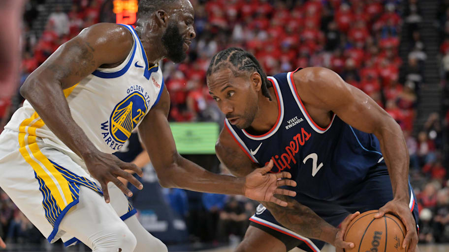 Warriors forward Draymond Green defends Clippers forward Kawhi Leonard.