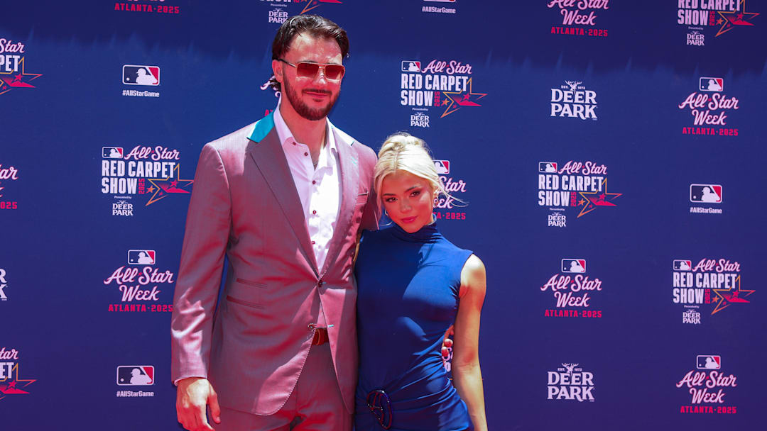 Jul 15, 2025; Atlanta, GA, USA; National League pitcher Paul Skenes (30) of the Pittsburgh Pirates and social media influencer Livvy Dunne pose for a photo on the red carpet before the 2025 MLB All Star Game at Truist Park. Mandatory Credit: Brett Davis-Imagn Images