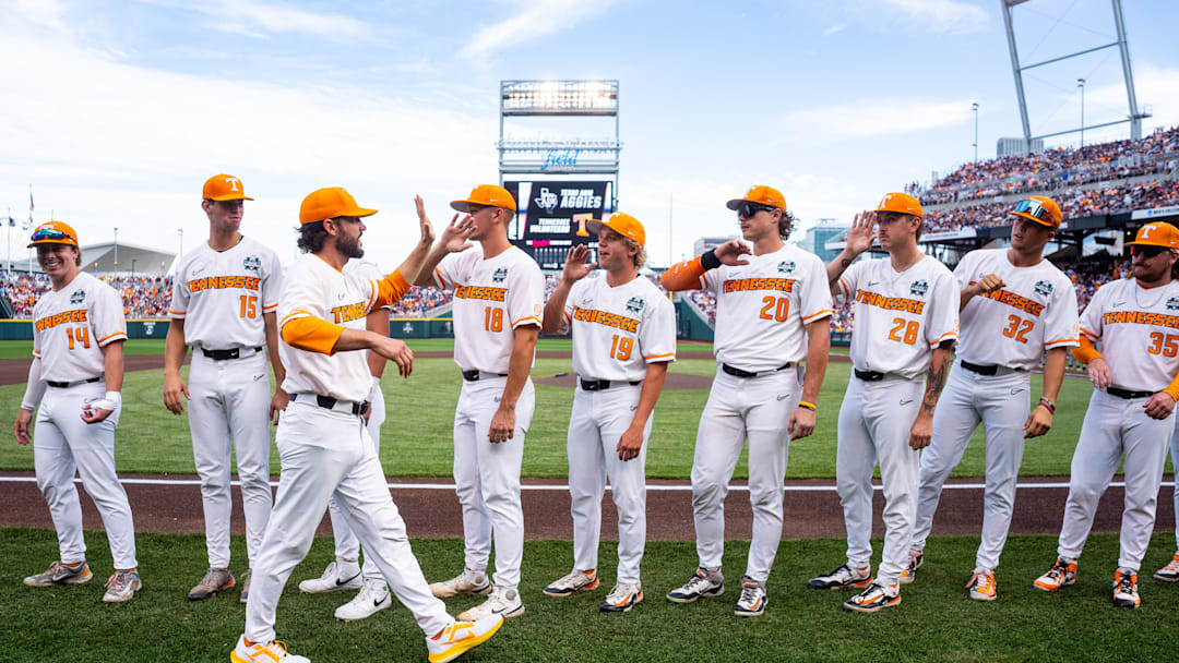 Jun 22, 2024; Omaha, NE, USA; Tennessee Volunteers head coach Tony Vitello high fives players before a game against the Texas A&M Aggies at Charles Schwab Field Omaha. Mandatory Credit: Dylan Widger-Imagn Images