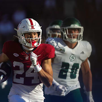 Sep 7, 2024; Stanford, California, USA; Stanford Cardinal wide receiver Tiger Bachmeier (24) returns a punt for a touchdown against the Cal Poly Mustangs during the second half at Stanford Stadium. Mandatory Credit: Sergio Estrada-Imagn Images