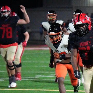 Cardinal Mooney running back Connail Jackson (34) heads for the end zone for a fourth-quarter touchdown against Cocoa in the Class 2A state semifinal on Dec. 5. Jackson went on to rush for 160 yards and four TDs to lead Mooney past Jacksonville Bolles, 52-28, to win the state championship on Dec. 10 at FIU in Miami.