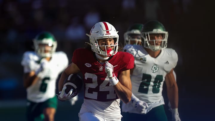 Sep 7, 2024; Stanford, California, USA; Stanford Cardinal wide receiver Tiger Bachmeier (24) returns a punt for a touchdown against the Cal Poly Mustangs during the second half at Stanford Stadium. Mandatory Credit: Sergio Estrada-Imagn Images