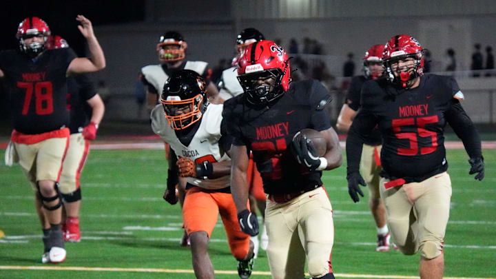 Cardinal Mooney running back Connail Jackson (34) heads for the end zone for a fourth-quarter touchdown against Cocoa in the Class 2A state semifinal on Dec. 5. Jackson went on to rush for 160 yards and four TDs to lead Mooney past Jacksonville Bolles, 52-28, to win the state championship on Dec. 10 at FIU in Miami. Cardinal Mooney running back Connail Jackson (34) heads for the end zone for a fourth-quarter touchdown against Cocoa in the Class 2A state semifinal on Dec. 5. Jackson went on to rush for 160 yards and four TDs to lead Mooney past Jacksonville Bolles, 52-28, to win the state championship on Dec. 10 at FIU in Miami.