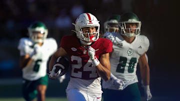 Sep 7, 2024; Stanford, California, USA; Stanford Cardinal wide receiver Tiger Bachmeier (24) returns a punt for a touchdown against the Cal Poly Mustangs during the second half at Stanford Stadium. Mandatory Credit: Sergio Estrada-Imagn Images