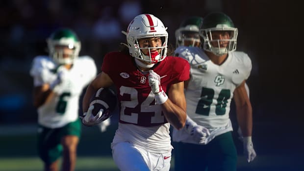 Stanford Cardinal wide receiver Tiger Bachmeier (24) returns a punt for a touchdown against the Cal Poly Mustangs