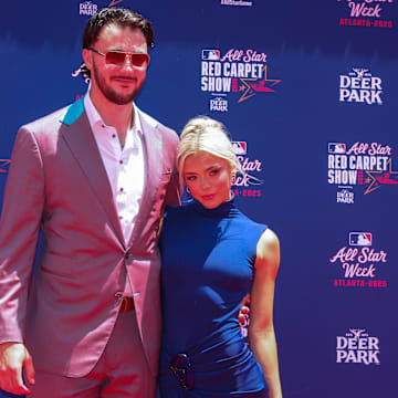 Jul 15, 2025; Atlanta, GA, USA; National League pitcher Paul Skenes (30) of the Pittsburgh Pirates and social media influencer Livvy Dunne pose for a photo on the red carpet before the 2025 MLB All Star Game at Truist Park. Mandatory Credit: Brett Davis-Imagn Images