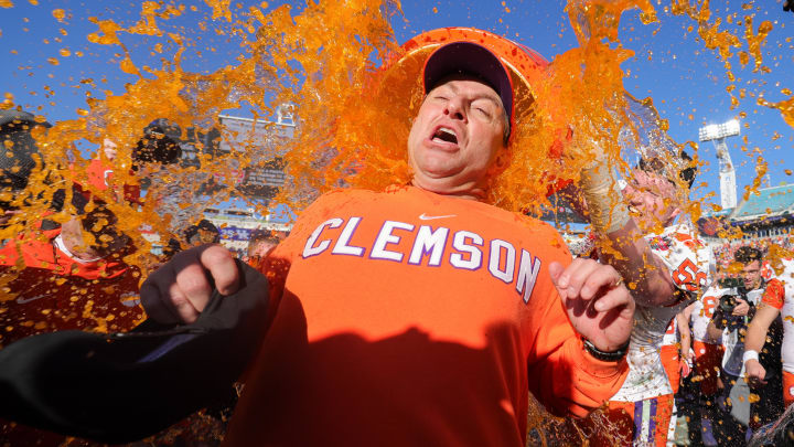 Dec 29, 2023; Jacksonville, FL, USA;  Clemson Tigers head coach Dabo Swinney is doused after beating the Kentucky Wildcats in the Gator Bowl at EverBank Stadium. 