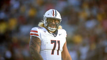 Nov 25, 2023; Tempe, Arizona, USA; Arizona Wildcats offensive lineman Jonah Savaiinaea (71) against the Arizona State Sun Devils during the Territorial Cup at Mountain America Stadium. Mandatory Credit: Mark J. Rebilas-USA TODAY Sports