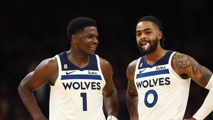 Nov 1, 2022; Phoenix, Arizona, USA; Minnesota Timberwolves guard Anthony Edwards (1) and guard D'Angelo Russell (0) against the Phoenix Suns at Footprint Center. Mandatory Credit: Mark J. Rebilas-USA TODAY Sports