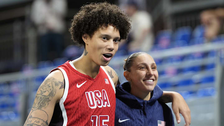 Aug 1, 2024; Villeneuve-d'Ascq, France; United States centre Brittney Griner (15) celebrates with shooting guard Diana Taurasi (12) after defeating Belgium in a women’s group stage game during the Paris 2024 Olympic Summer Games at Stade Pierre-Mauroy. Mandatory Credit: John David Mercer-Imagn Images