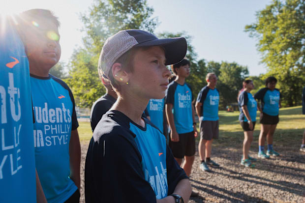 Kids prepare for a road race.