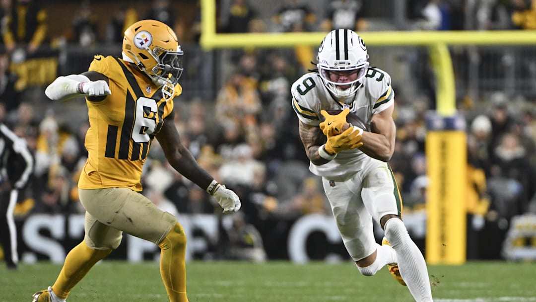 Oct 26, 2025; Pittsburgh, Pennsylvania, USA; Green Bay Packers wide receiver Christian Watson (9) makes a catch against Pittsburgh Steelers linebacker Patrick Queen (6) during the fourth quarter at Acrisure Stadium. Mandatory Credit: Barry Reeger-Imagn Images Oct 26, 2025; Pittsburgh, Pennsylvania, USA; Green Bay Packers wide receiver Christian Watson (9) makes a catch against Pittsburgh Steelers linebacker Patrick Queen (6) during the fourth quarter at Acrisure Stadium. Mandatory Credit: Barry Reeger-Imagn Images