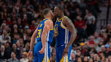 Oct 23, 2024; Portland, Oregon, USA;  Golden State Warriors point guard Stephen Curry (30) and power forward Draymond Green (23) celebrate during the second half against the Portland Trailblazers at Moda Center. Mandatory Credit: Stephen Brashear-Imagn Images