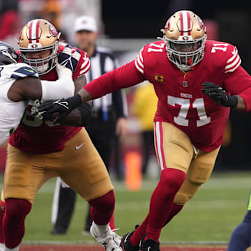 Dec 10, 2023; Santa Clara, California, USA; San Francisco 49ers offensive tackle Trent Williams (71) blocks Seattle Seahawks safety Julian Love (20) during the fourth quarter at Levi's Stadium. Mandatory Credit: Darren Yamashita-Imagn Images