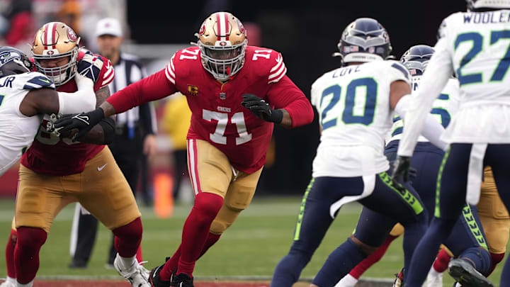 Dec 10, 2023; Santa Clara, California, USA; San Francisco 49ers offensive tackle Trent Williams (71) blocks Seattle Seahawks safety Julian Love (20) during the fourth quarter at Levi's Stadium. Mandatory Credit: Darren Yamashita-Imagn Images