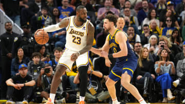 Jan 27, 2024; San Francisco, California, USA; Los Angeles Lakers forward LeBron James (23) dribbles against Golden State Warriors guard Klay Thompson (right) during the fourth quarter at Chase Center. Mandatory Credit: Darren Yamashita-USA TODAY Sports