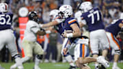 Nov 8, 2025; Charlottesville, Virginia, USA; Virginia Cavaliers quarterback Chandler Morris (4) runs with the ball and is injured on the play during the first half against the Wake Forest Demon Deacons at Scott Stadium. Mandatory Credit: Amber Searls-Imagn Images