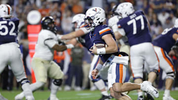 Nov 8, 2025; Charlottesville, Virginia, USA; Virginia Cavaliers quarterback Chandler Morris (4) runs with the ball and is injured on the play during the first half against the Wake Forest Demon Deacons at Scott Stadium. Mandatory Credit: Amber Searls-Imagn Images
