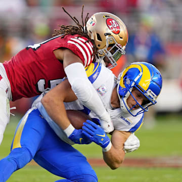 Oct 3, 2022; Santa Clara, California, USA; San Francisco 49ers linebacker Fred Warner (54) tackles Los Angeles Rams wide receiver Cooper Kupp (10) during the second quarter at Levi's Stadium. Mandatory Credit: Kyle Terada-Imagn Images