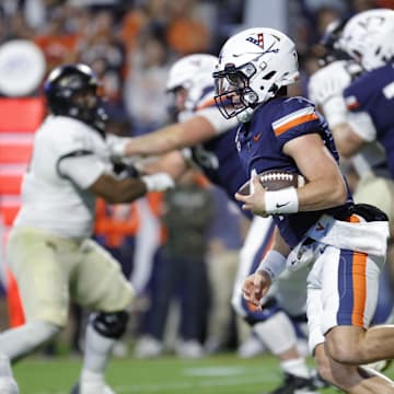 Nov 8, 2025; Charlottesville, Virginia, USA; Virginia Cavaliers quarterback Chandler Morris (4) runs with the ball and is injured on the play during the first half against the Wake Forest Demon Deacons at Scott Stadium. Mandatory Credit: Amber Searls-Imagn Images