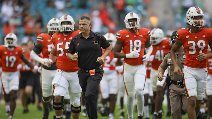 Oct 28, 2023; Miami Gardens, Florida, USA; Miami Hurricanes head coach Mario Cristobal takes on the field prior to the game against the Virginia Cavaliers at Hard Rock Stadium. Mandatory Credit: Sam Navarro-Imagn Images