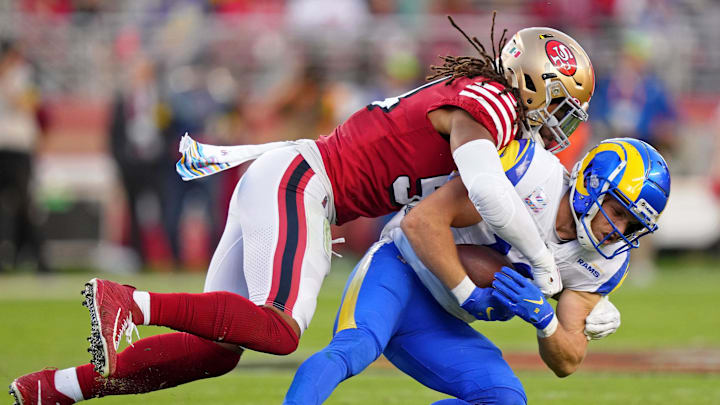 Oct 3, 2022; Santa Clara, California, USA; San Francisco 49ers linebacker Fred Warner (54) tackles Los Angeles Rams wide receiver Cooper Kupp (10) during the second quarter at Levi's Stadium. Mandatory Credit: Kyle Terada-Imagn Images