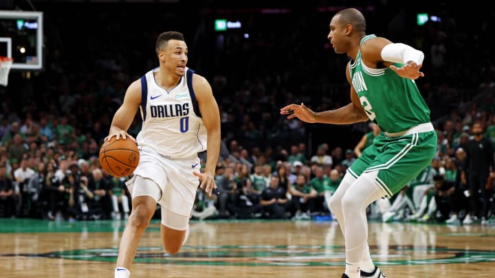 Jun 17, 2024; Boston, Massachusetts, USA; Dallas Mavericks guard Dante Exum (0) drives to the basket against Boston Celtics center Al Horford (42) in game five of the 2024 NBA Finals at TD Garden. Mandatory Credit: Peter Casey-USA TODAY Sports