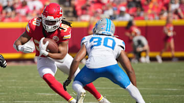 Aug 17, 2024; Kansas City, Missouri, USA; Kansas City Chiefs running back Keaontay Ingram (30) runs the ball as Detroit Lions cornerback Khalil Dorsey (30) defends during the first half at GEHA Field at Arrowhead Stadium. Mandatory Credit: Denny Medley-Imagn Images
