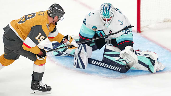 Apr 10, 2025; Las Vegas, Nevada, USA; Seattle Kraken goaltender Joey Daccord (35) makes a save against Vegas Golden Knights right wing Reilly Smith (19) during the third perod at T-Mobile Arena. Mandatory Credit: Stephen R. Sylvanie-Imagn Images