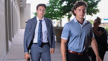 Michael McLeod (left) shortly before entering court to hear the verdict