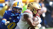 Oct 4, 2025; Pittsburgh, Pennsylvania, USA; Boston College Eagles running back Turbo Richard (2) runs the ball as Pittsburgh Panthers linebacker Braylan Lovelace (0) chases during the first quarter against at Acrisure Stadium. Mandatory Credit: Charles LeClaire-Imagn Images
