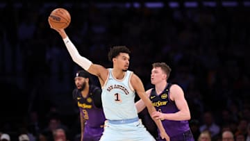 Jan 13, 2025; Los Angeles, California, USA;  San Antonio Spurs center Victor Wembanyama (1) posts up against Los Angeles Lakers guard Dalton Knecht (4) during the second quarter at Crypto.com Arena. Mandatory Credit: Kiyoshi Mio-Imagn Images