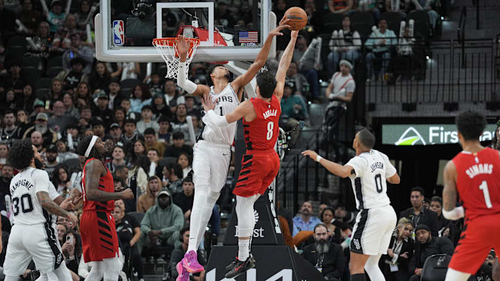 Dec 21, 2024; San Antonio, Texas, USA; San Antonio Spurs center Victor Wembanyama (1) blocks a shot by Portland Trail Blazers forward Deni Avdija (8) in the second half at Frost Bank Center. Mandatory Credit: Daniel Dunn-Imagn Images Dec 21, 2024; San Antonio, Texas, USA; San Antonio Spurs center Victor Wembanyama (1) blocks a shot by Portland Trail Blazers forward Deni Avdija (8) in the second half at Frost Bank Center. Mandatory Credit: Daniel Dunn-Imagn Images