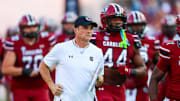 Nov 22, 2025; Columbia, South Carolina, USA; South Carolina Gamecocks head coach Shane Beamer leads his team onto the field before their game against the Coastal Carolina Chanticleers at Williams-Brice Stadium. Mandatory Credit: Jeff Blake-Imagn Images