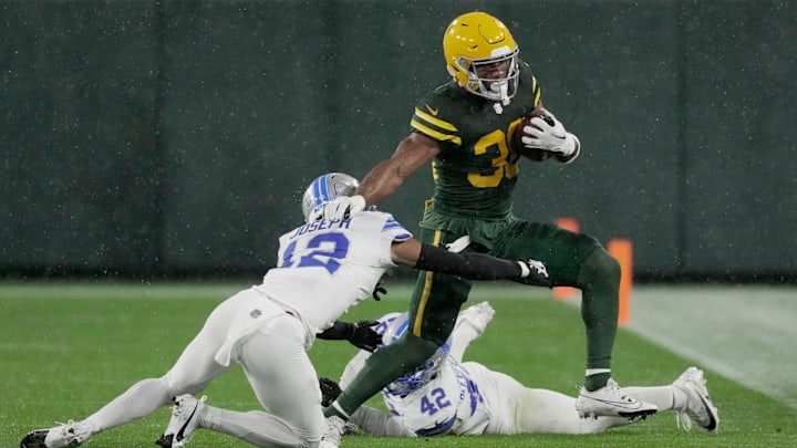 Green Bay Packers running back Chris Brooks (30) picks up some yardage during the second quarter of their game against the Detroit Lions Sunday, November 3, 2024, at Lambeau Field in Green Bay, Wisconsin.