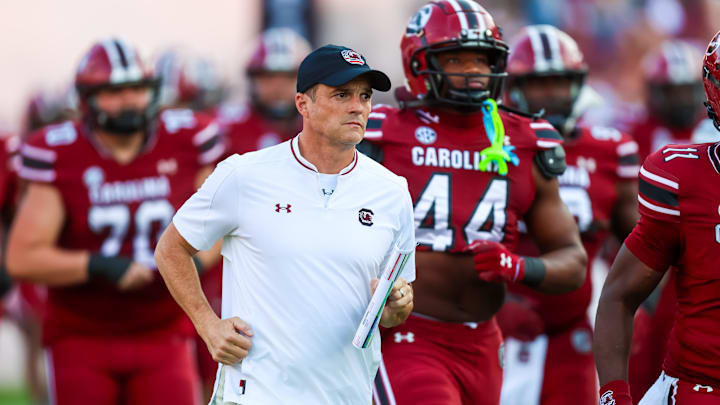 Nov 22, 2025; Columbia, South Carolina, USA; South Carolina Gamecocks head coach Shane Beamer leads his team onto the field before their game against the Coastal Carolina Chanticleers at Williams-Brice Stadium. Mandatory Credit: Jeff Blake-Imagn Images