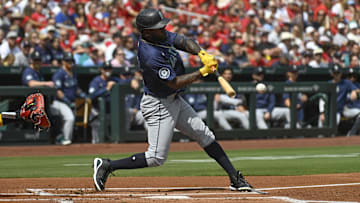 Seattle Mariners left fielder Randy Arozarena hits a single during a game against the St. Louis Cardinals on Sunday at Busch Stadium.